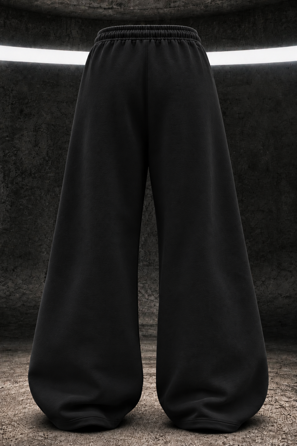 Black wide-leg sweatpants with an elastic waistband, shown from the back against a dark textured studio background.
