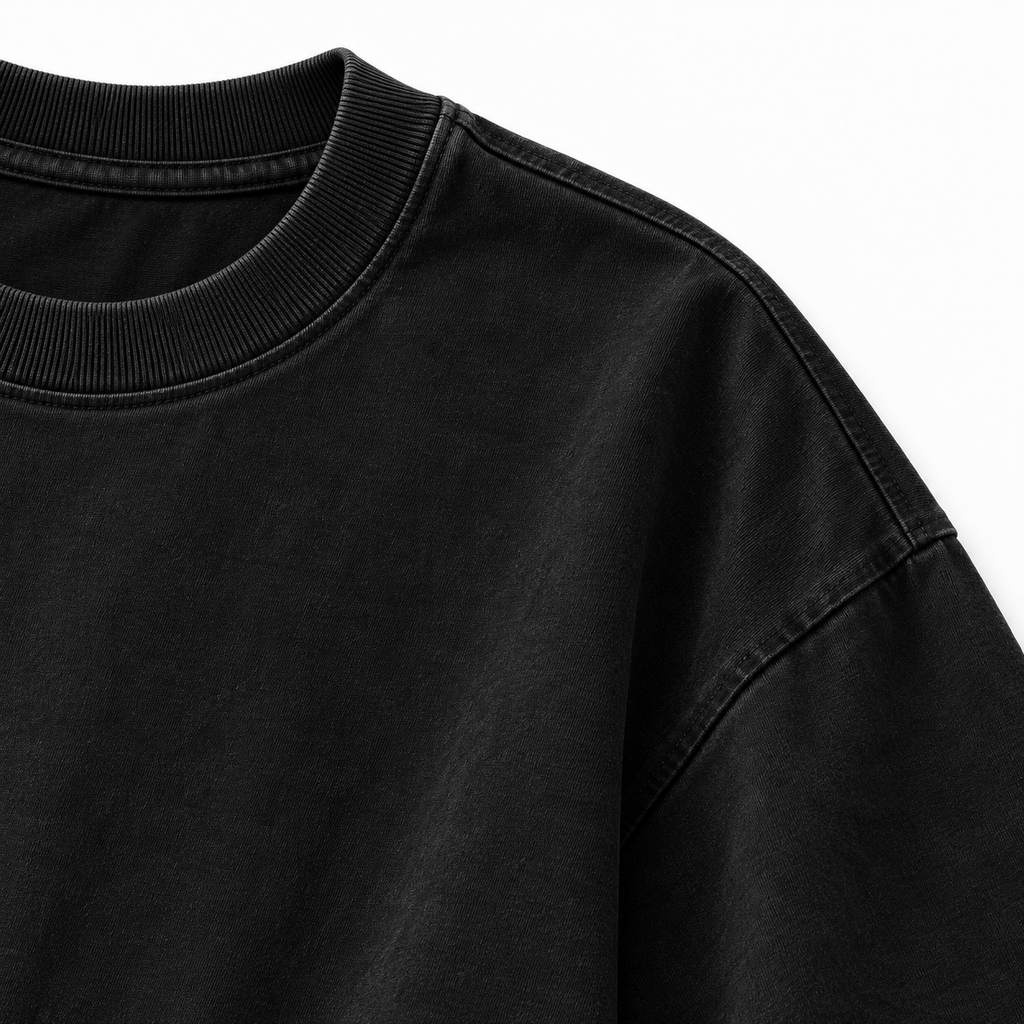 Black oversized statement T-shirt collar and fabric close-up
